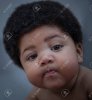 106580309-beautiful-black-baby-with-an-afro-making-a-cool-face.jpg